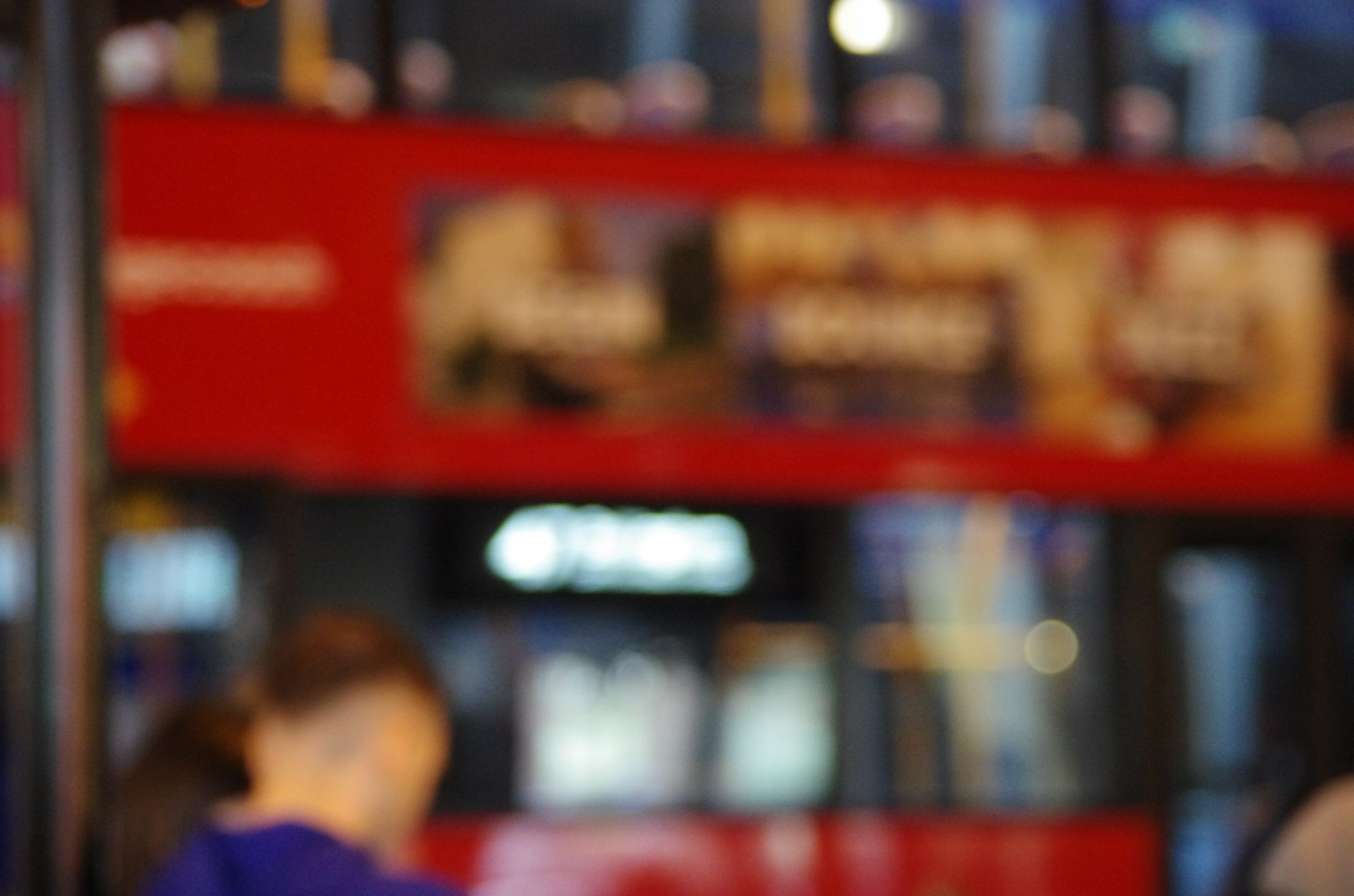 Red neon signs at night, out of focus